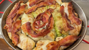 Pan showing bacon topped cabbage rolls